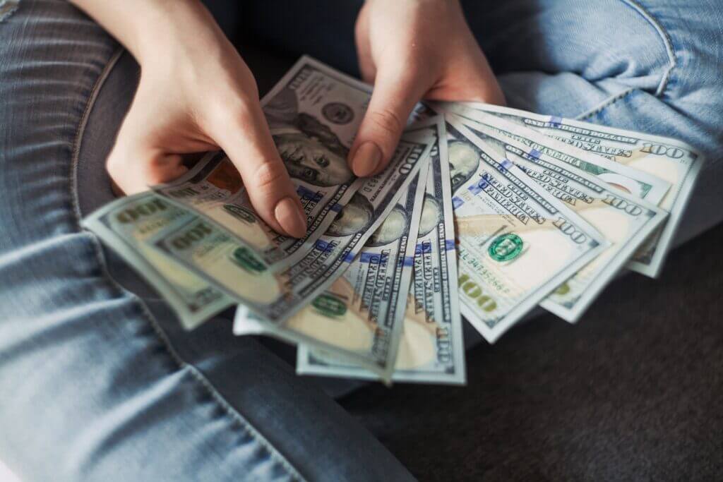 woman fanning cash